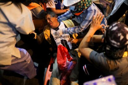  A wounded protestor is assisted after being wounded on Thursday, December 15 in Lima, Peru.