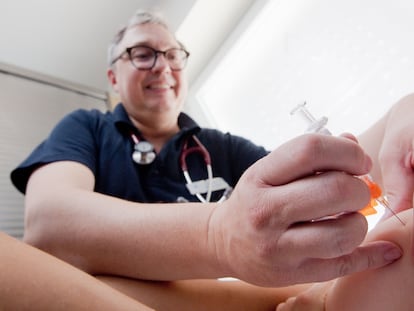 A pediatrician gives a baby the measles vaccine in Hanover, Germany.