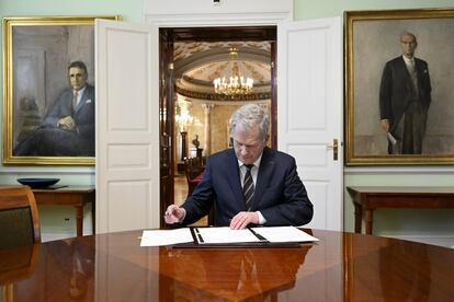 Finnish President Sauli Niinisto signs Finland's National NATO legislation in Helsinki on March 23, 2023.