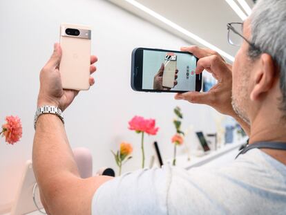 A potential buyer snaps a photo of the Google Pixel 8 Pro in New York; October 4, 2023.