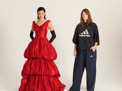 Nine d'Urso poses with Bina Daigeler, the costume designer for the 'Balenciaga' series. The actress wears a reproduction of a ruffled evening dress that Balenciaga showed in 1952. Daigeler wears a Balenciaga x Adidas T-shirt and tracksuit pants, created by Demna Gvasalia, the current creative director of the House of Balenciaga.