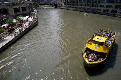 A water taxi is seen on the Chicago River in Chicago, Monday, July 3, 2023, a day after heavy rains flooded Chicago streets and neighborhoods.