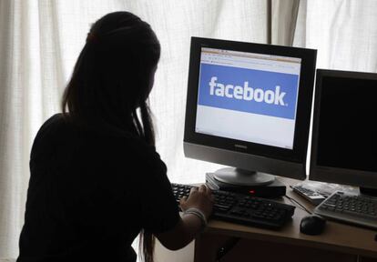 FILE - In this Monday, June 4, 2012, file photo, a girl looks at Facebook on her computer in Palo Alto, Calif. Most teenagers have taken a break from social media, according a new poll from The Associated Press-NORC Center for Public Affairs Research. The breaks are both voluntary and involuntary, such as when a parent takes their phone away as punishment. (AP Photo/Paul Sakuma, File)