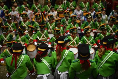 EDS NOTE : SPANISH LAW REQUIRES THAT THE FACES OF MINORS ARE MASKED IN PUBLICATIONS WITHIN SPAIN. ''Tamborilleros'' wearing their uniforms march in the traditional ' La Tamborrada', during 'El Dia Grande', the main day of San Sebastian feasts, in the Basque city of San Sebastian, northern Spain, Saturday, Jan. 20, 2018. From midnight to midnight companies of perfectly uniformed marchers parade through the streets of San Sebastian playing drums and barrels in honor of their patron saint. (AP Photo/ Alvaro Barrientos)