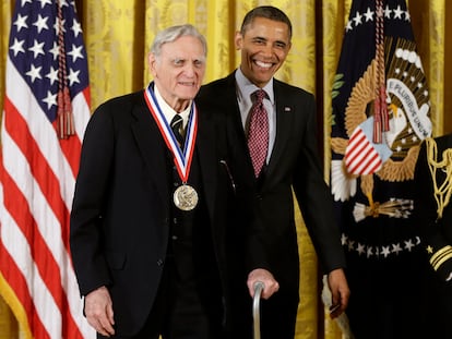 Then-President Barack Obama awards the National Medal of Science to Dr. John Goodenough, of the University of Texas, during a ceremony in the East Room of the White House in 2013.