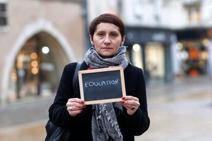 Nathalie Harlingue, 41, a school teacher, holds a blackboard with the word "education", the most important election issue for her, as she poses for Reuters in Chartres, France February 1, 2017.  REUTERS/Stephane Mahe SEARCH "ELECTION CHARTRES" FOR THIS STORY. SEARCH "THE WIDER IMAGE" FOR ALL STORIES