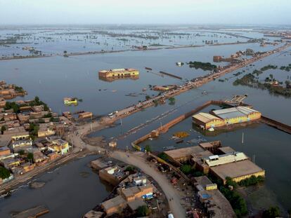 Homes are surrounded by floodwaters in Sohbat Pur city, a district of Pakistan's southwestern Baluchistan province, on August 29, 2022.