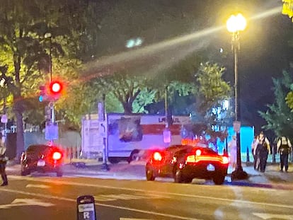 A box truck is seen crashed into a security barrier at a park across from the White House, Monday night, Washington