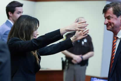 Camille Vasquez and Benjamin Chew, Jonny Depp's attorneys, celebrate his victory.