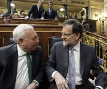 El presidente del Gobierno, Mariano Rajoy, con el ministro de Asuntos Exteriores, José Manuel García-Margallo. EFE/Archivo