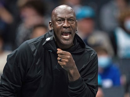 Michael Jordan looks on during the first half of an NBA basketball game between the Charlotte Hornets and the New York Knicks in Charlotte, North Carolina, in 2021.