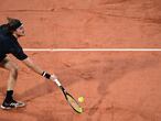 Greece's Stefanos Tsitsipas returns the ball to Spain's Jaume Munar during their men's singles first round tennis match at the Suzanne Lenglen court on Day 3 of The Roland Garros 2020 French Open tennis tournament in Paris on September 29, 2020. (Photo by MARTIN BUREAU / AFP)