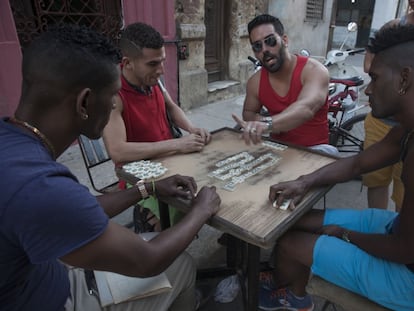 A group of Cubans playing domino on a Havana street.