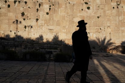 A Jew walks near the Tomb of the Patriarchs in the old town of Hebron.