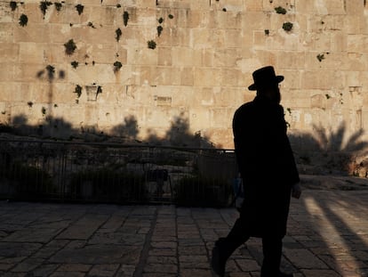 A Jew walks near the Tomb of the Patriarchs in the old town of Hebron.