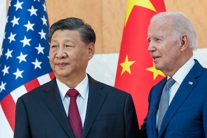 Joe Biden, right, stands with Chinese President Xi Jinping