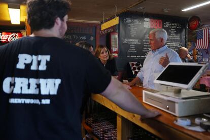 Republican presidential candidate former U.S. Vice President Mike Pence talks to workers at Goody Coles BBQ Joint in Brentwood, New Hampshire, U.S., July 20, 2023.