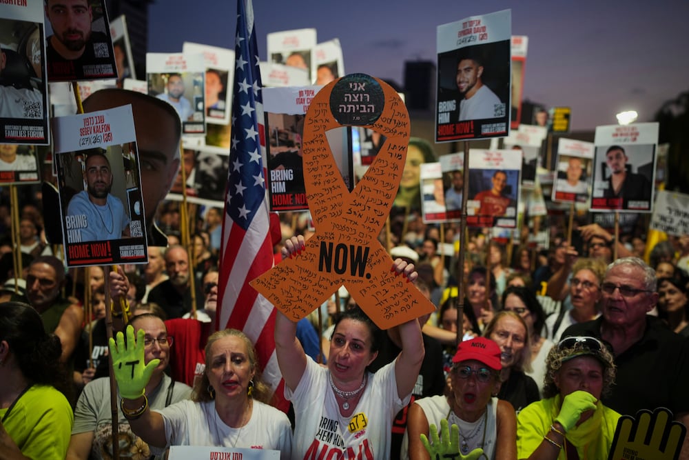 Relatives and supporters of Israeli hostages held in the Gaza Strip attend a rally demanding their release from Hamas captivity and calling for an end to the war, in Tel Aviv, Israel, Saturday, Aug. 9, 2025. (AP Photo/Ohad Zwigenberg)