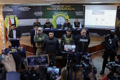 Military personnel are presented during a press conference after the Bolivian armed forces withdrew from the presidential palace.