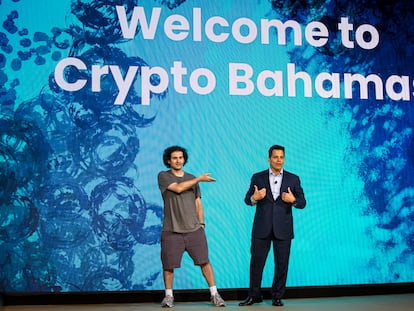 FTX founder Sam Bankman-Fried (left) at a cryptocurrency event in the Bahamas on April 27, 2022, just months before his arrest.
