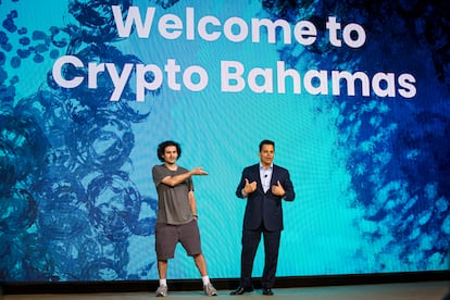 FTX founder Sam Bankman-Fried (left) at a cryptocurrency event in the Bahamas on April 27, 2022, just months before his arrest.