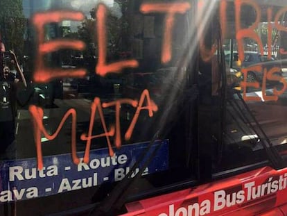 The bus was sprayed with the words “Tourism kills the barrio.”