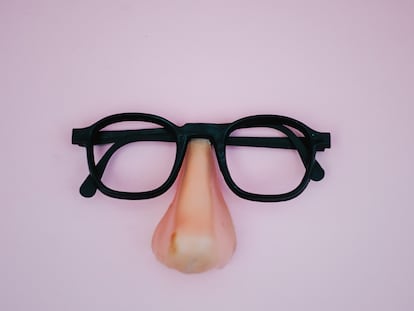 funny plastic glasses in pink background