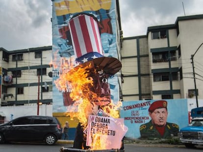 A giant effigy of President Obama burns on a street in Caracas.