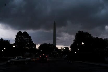 Storm clouds pass over the Washington Monument, on Aug. 7, 2023, in Washington.