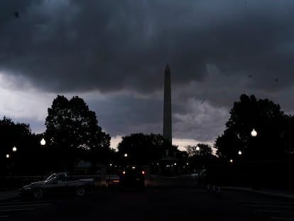 Storm clouds pass over the Washington Monument, on Aug. 7, 2023, in Washington.