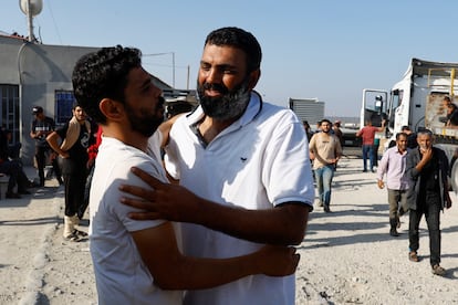 A Palestinian worker, who was in Israel during the Hamas attack on October 7, was greeted upon his arrival Friday after being returned by Israel to the Gaza Strip.