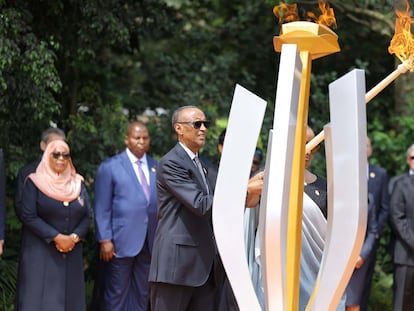 Rwandan President Paul Kagame and first lady Jeanette Kagame prepare to light the flame of hope to commemorate the 1994 genocide at the Genocide Memorial Center in Kigali on Sunday.