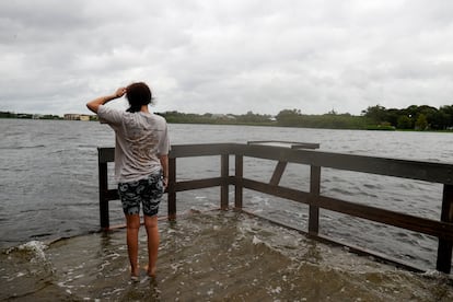 Chloe Gray, 19, of Safety Harbor wades in the water at the Oldsmar Pier before Hurricane Helene arrives on Thursday, Sept. 26, 2024, in Oldsmar, Fla. 