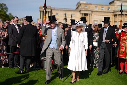King Charles III and Queen Camilla attend a royal garden party at Buckingham Palace on May 8, 2024 in London, England.