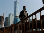 A walks by Beijing's Central Business District during morning rush hour as the spread of the new coronavirus disease (COVID-19) continues in China, April 17, 2020, REUTERS/Thomas Peter