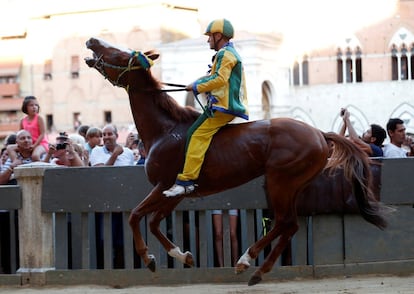 Jockey Luigi Bruschelli of the "Bruco" ( Caterpillar) parish struggles with his horse after the start of the third practices for the Palio of Siena, Italy August 14, 2017. REUTERS/Stefano Rellandini  NO SALES.
