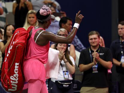 Venus Williams of the U.S. acknowledges fans after losing her first round match against Belgium's Greet Minnen.