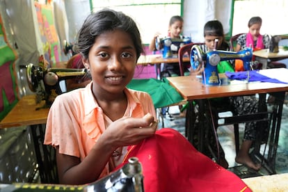 A girl in Cox's Bazar refugee camp learns to sew.
