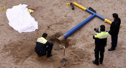 The body of the youngster lies next to the collapsed swing set.