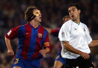 Puyol y Diego Alonso, en un duelo entre el Barça y el Racing de 2003.