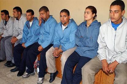 Los siete inmigrantes, tras ser localizados en un contenedor de un barco atracado en Málaga.