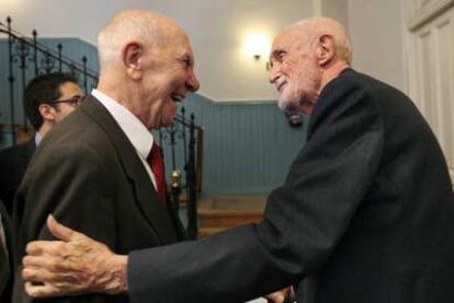 José Luis Sampedro (r) greets Stéphane Hessel in Madrid last week.