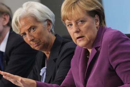 Angela Merkel, junto a Christine Lagarde y Robert Zoellick en Berlín.