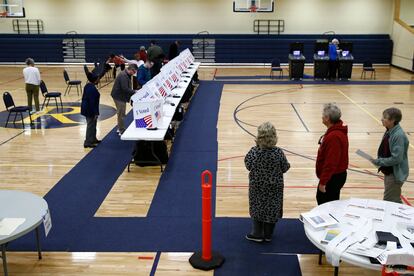 Voters fill out their ballots at a primary polling place, Feb. 29, 2020, in North Charleston, S.C.