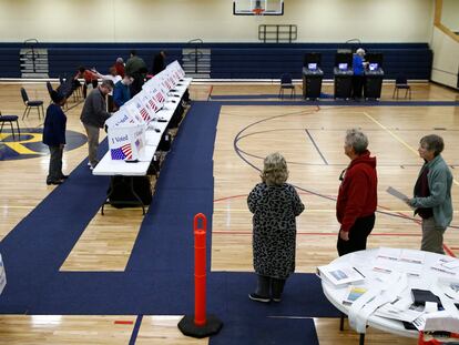 Voters fill out their ballots at a primary polling place, Feb. 29, 2020, in North Charleston, S.C.