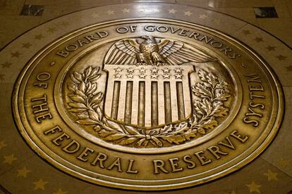 FILE- In this Feb. 5, 2018, file photo, the seal of the Board of Governors of the United States Federal Reserve System is displayed in the ground at the Marriner S. Eccles Federal Reserve Board Building in Washington. Federal Reserve Governor Michelle Bowman said Monday, Feb. 21, 2022, that she was open to lifting interest rates by more than the traditional quarter-point at the central bank's next meeting in March. (AP Photo/Andrew Harnik, File)