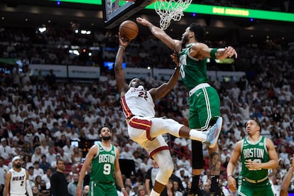 Miami Heat forward Jimmy Butler (22) goes up for a shot against Boston Celtics forward Jayson Tatum (0) during the first half of Game 6 of the NBA basketball Eastern Conference finals, on May 27, 2023.