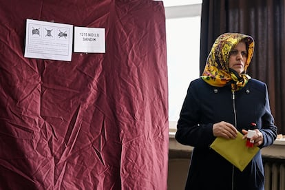 A woman attends voting at a polling station during the presidential and parliamentary elections, in Istanbul, Turkey May 14, 2023.