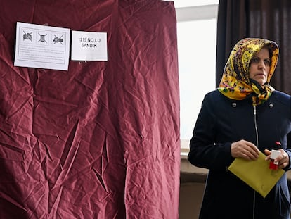 A woman attends voting at a polling station during the presidential and parliamentary elections, in Istanbul, Turkey May 14, 2023.
