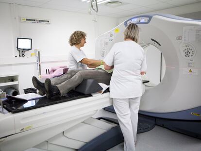 A woman undergoes a CT scan in the radiotherapy unit of a hospital in Savoie, France.